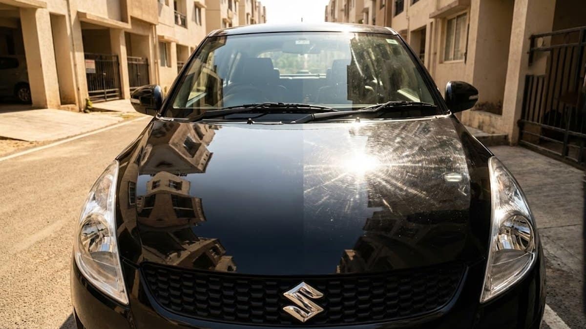 Hidden swirl marks and micro scratches on black car paint in Indian sunlight
